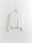Chemisier blanc volants